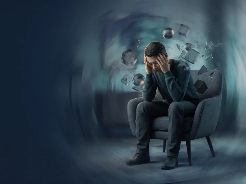 A person (adult male) having an anxiety / panic attack, experiencing panic symptoms, and the sensation of being about to faint.